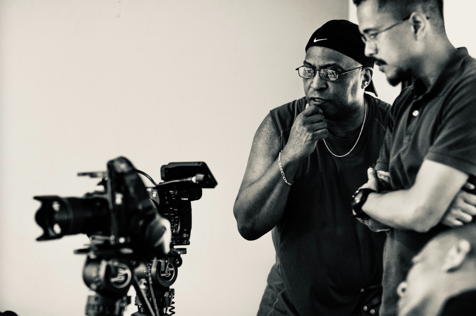 Two collaborators reviewing a camera setup